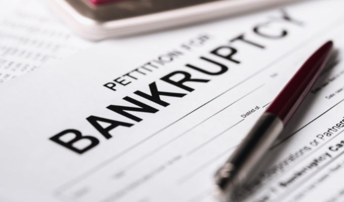 Why are bankruptcies expected to surge?